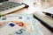 Desk with accountant book, Euros banknotes and calculator. Wealth.