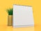 Desk blank calendar mockup on yellow background. 3D illustration