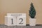 Desk calendar for use in different ideas. Summer month - August and the number on the cubes 12. Calendar of holidays on a beige