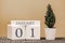 Desk calendar for use in different ideas. Winter month - January and the number on the cubes 01. Calendar of holidays on a beige