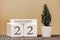 Desk calendar for use in different ideas. Winter month - January and the number on the cubes 22. Calendar of holidays on a beige