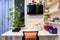 A desk in the children`s room, on the wall a TV and shelves for school books