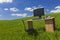 Desk and Computer In Green Field With Blue SKy