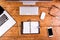 Desk, gadgets and office supplies. Flat lay. Wooden desk.