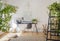 Desk and a wooden chair in a sunlit workspace interior for an il