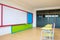 Desks, chairs and white board in the kindergarten classroom