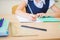 Desktop background of student sitting at desk for classwork