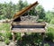 Desolate piano at a garden