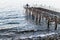 Desolated Dock On Sunset With Calm Sea