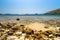 A desolated pebble beach on the Adriatic Sea near the city of Dubvronik. The water is crystal clear with a turquoise color