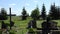 Despair mourning son man sit on bench near father grave in cemetery. 4K