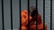 Desperate black prisoner sitting in cell, wrongly accused person, faulty system