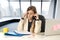 Desperate businesswoman suffering stress at office laptop computer desk