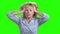 Desperate mature woman on chroma key background.