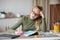 Desperate schooler looking at book, doing homework at home