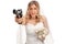 Desperate young bride holding a gun