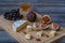 Dessert appetizers to wine - figs, brie cheese, red grapes, honey served on a wooden board