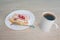 Dessert and coffee on wooden table. Slice vanilla cake and coffee in the plate on wooden table