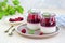 Dessert, creamy panna cotta with cherry sauce in in vintage glass jars