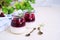 Dessert, creamy panna cotta with cherry sauce in in vintage glass jars