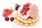 Dessert of currant, ise-cream, cherry and waffles