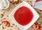 dessert, first course, strawberry soup in a white plate on a wooden table