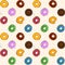 Dessert food vector seamless pattern with colorful donuts