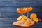 Dessert glasses of orange jelly served on blue wooden table