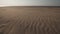 Dessert like textured sand - Baltic sea gulf beach with white sand in the sunset - 4K video with slow camera movement