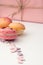 dessert macarons on a white background decorated with delicate candy hearts