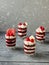 Dessert  portioned in glasses.  Red biscuit with raspberry jelly, cream and fresh raspberries