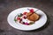 dessert shortbread cake with chocolate and berries on a white plate