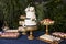 Dessert table with two tiered cake at wedding reception or party
