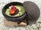 Dessert Tiramisu with chocolate chips and fresh strawberries in a ceramic decorative dishware