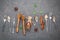 Desserts background and menu design. Metal utensils ,honey dipper ,star anise and cinnamon sticks setup on dark stone background.