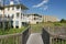 Destin, Florida- Boardwalk with a view of elevated residential buildings near the lake