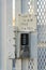 Destin, Florida- Stainless steel key code lock of a gate with Don't slam the gate note