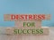 Destress for success symbol. Concept words Destress for success on brick blocks. Wooden table. Beautiful blue background.