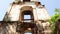 The destroyed bell tower with arched openings goes into the sky.