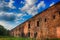 Destroyed brick wall in the Brest Fortress on a sunny spring day