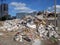 Destroyed building, earthquake, pile of rubble and debris, landfill