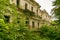 Destroyed building of the Palace. Ruins of the estate in the forest.