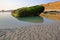 A destroyed bunker on the beach at sunset in Ambleteuse near Wimereux, Cote d`Opale, Pas de Calais, Hauts de France