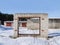 Destroyed gate of garage, winter time