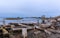 Destroyed pier and an old log cabin on the shore, on a small des