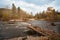 Destroyed road bridge after floods in the distant area