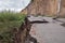 Destroyed road consequences of a natural cataclysm of a landslide.