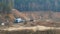 Destroyed train among the sand ballast quarry on the cloudy summer day