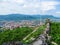 Destroyed wall of Khust fortress and the panorama of Khust on a background of Carpathians - top view. The delightful landscape of