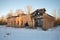 The destruction of an abandoned building public baths on a January evening. Working village Russian America, mining of peat in the